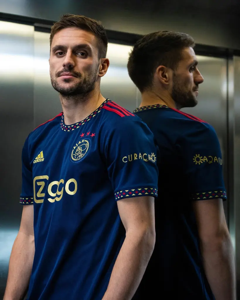 The New Champions' Attire: An In-depth Look at Ajax's 2022-23 Away Kit in Collaboration with Adidas